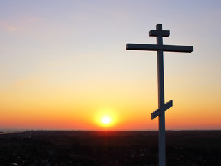 Christian symbol at sunset texture background