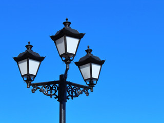 Fototapeta na wymiar vintage lantern on sky background close-up