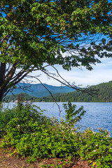 View over Burrard Inlet, ocean and island with boat and mountains in beautiful British Columbia. Canada.