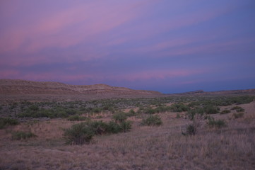 Sunset over bluff, south of Meeteetse, Wyoming on Highway 120
