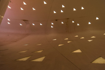 a man-made space with triangular lighting decorations