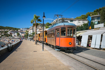 Plakat Port De Soller, tramway connecting town to Soller opened in 1913 and is about 5 km long.