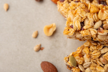 granola bars with nuts on a light background with space for design, horizontal photo, diet, proper nutrition