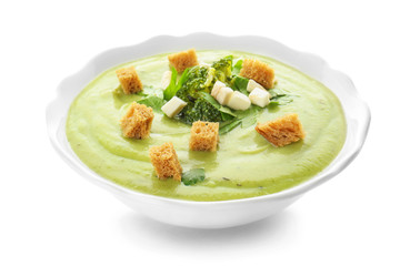 Bowl of tasty broccoli cream soup on white background