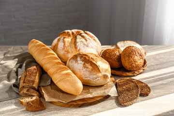 Assortment of fresh bread on table
