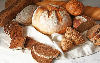 Assortment of fresh bread on table