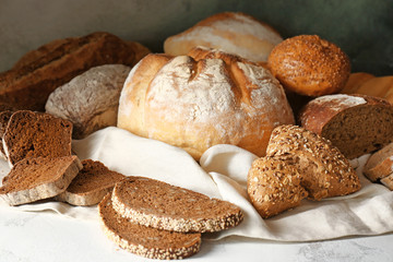 Assortment of fresh bread on table
