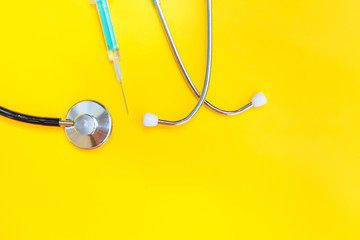 Simply minimal design with medicine equipment stethoscope or phonendoscope and syringe isolated on...