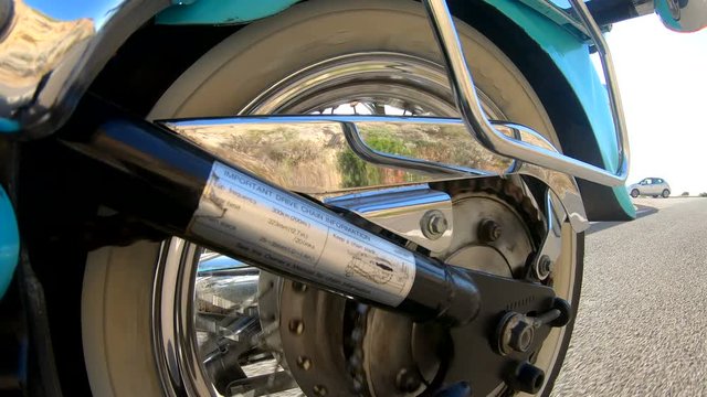 Motorcycle ride seen from the rear wheel
