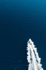 Aerial view of fast motor boat on sea