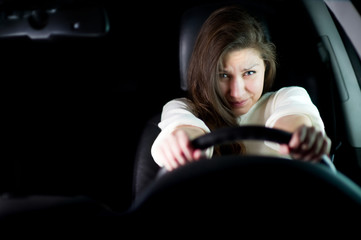 portrait of a young girl abruptly pressing the brakes in an attempt to avoid a road accident