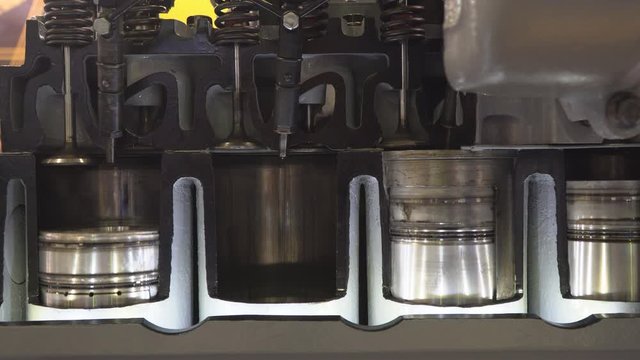 The structure and operation of the diesel engine of the truck in the context, close-up