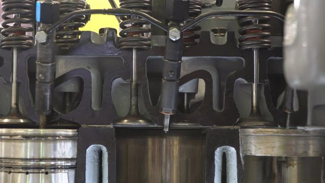The structure and operation of the diesel engine of the truck in the context, close-up