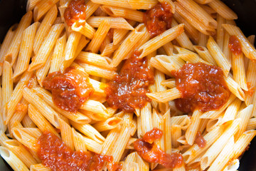 cooking spaghetti with a special sauce with cheese. pasta close-up