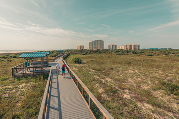 Aerial of Active Seniors Walking the Boardwalk in New Smyrna Beach, Florida.