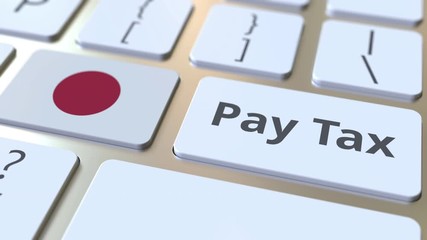 PAY TAX text and flag of Japan on the buttons on the computer keyboard. Taxation related conceptual 3D animation