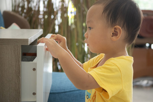 Baby Opening Drawer, Asian Boy Opening A Drawer,Children Explore The Open Drawer,