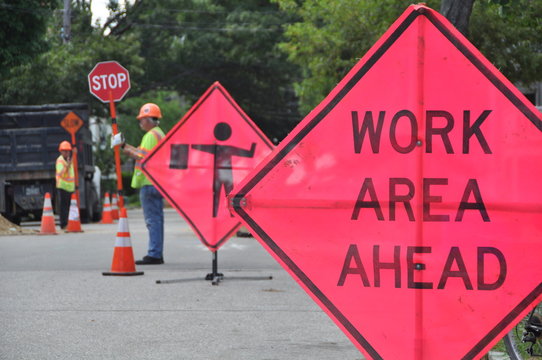 Construction Work Sign, Flaggers and Cones