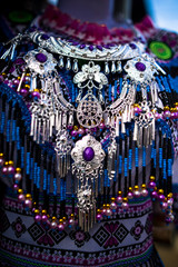 Traditional costume and necklace commonly found in Bac Ha market in the rural town of Lao Cai near...