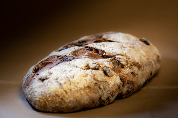 Bread loaf close up on a brown background