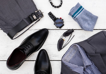 Men fashion casual clothing set and accessories on wooden background include oxford black shoes,...
