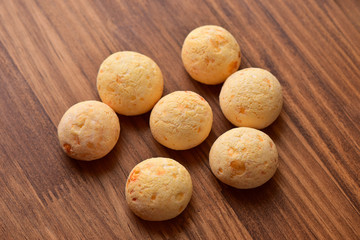 Pão de Queijo - Brazilian snack on wooden background