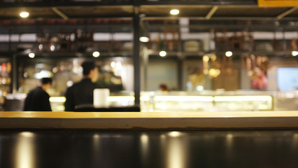 Fototapeta na wymiar Blur or Defocus image of restaurants or Cafeteria ,Customer at restaurant Chef cooking blur background with bokeh for use as Background.