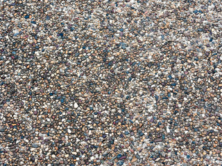 Coarse sand and clear sea water.