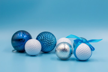 Golf ball with blue ribbon on blue background