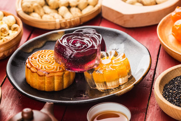 Obraz na płótnie Canvas Traditional mooncakes on table setting with teacup.