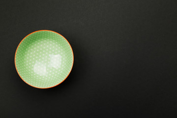 Dishes for asian food on black background. Top view, copy space