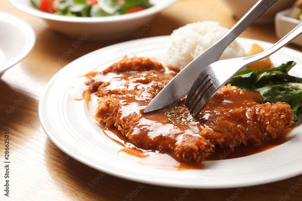 Wall mural fork cutlet on a plate