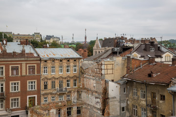 Fototapeta na wymiar Lviv, Ukraine - August 13, 2019: View of the roofs and old houses in the central part of Lviv