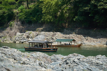 Katsura River,Kyoto,Japan - July 7,2019 : Tourists on the boats in the Katsura river