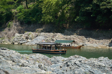Katsura River,Kyoto,Japan - July 7,2019 : Tourists on the boats in the Katsura river