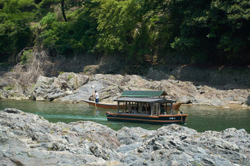 Katsura River,Kyoto,Japan - July 7,2019 : Tourists on the boats in the Katsura river