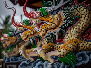 Fototapeta na wymiar Tha Rua Shrine one most prominent Taoist shrines on Phuket Island, with its colorful and ornate dragon motif decor. 