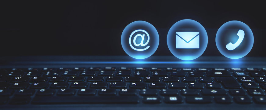 Contact symbols in the laptop keyboard. - Powered by Adobe