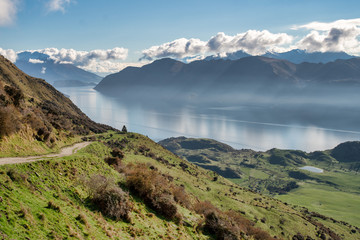 stunning scenery from the top of Roys Peak at Wanaka looking over  lakes and the snow capped Southern Alps