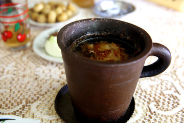 Azerbaijan Sheki piti soup prepared with mutton, tail fat, chickpeas, onions, dried alycha and saffron and cooked in a clay pot