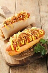 Hot dog on wooden board