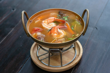 Tom yam kung or Tom yum, Tom yam is a spicy clear soup typical in Thailand. Popular food in Thailand