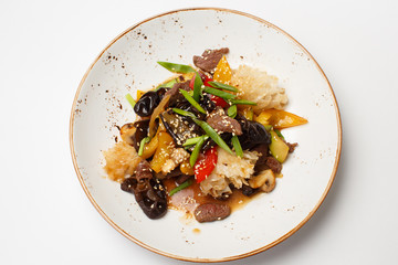 warm beef salad with a vegetables and fruits