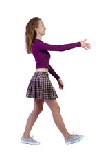 Back view of a woman who comes welcomes someone with hand.