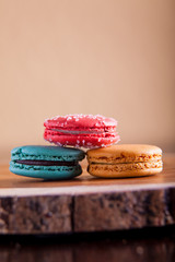 Macaroons close up on wood platter