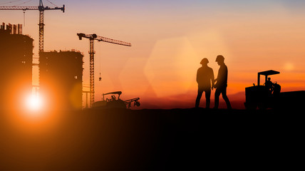 Fototapeta na wymiar Silhouette of engineer and construction team working at site over blurred background for industry background with Light fair.Create from multiple reference images together
