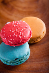 Macaroons close up on wood platter