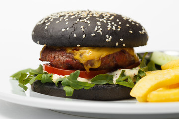black burger with pork chop cheese and a arugula