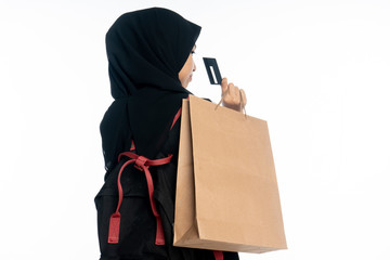 closeup of asian woman holding shopping bag on white background