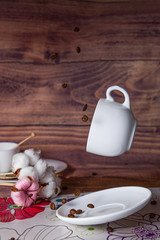 flying food tea drinking donut in the air on a wooden background with colored sprinkling cake cheesecake with fresh berries strawberries